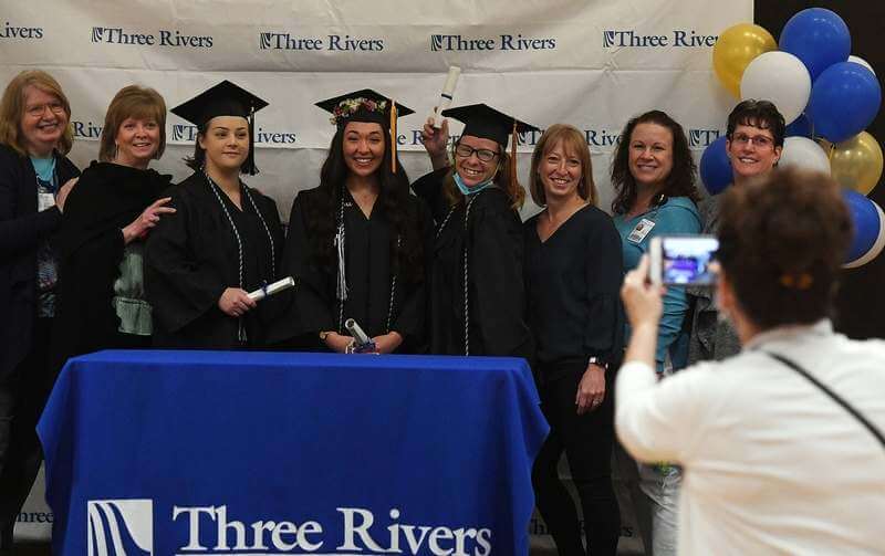 nursing students pose with instructors